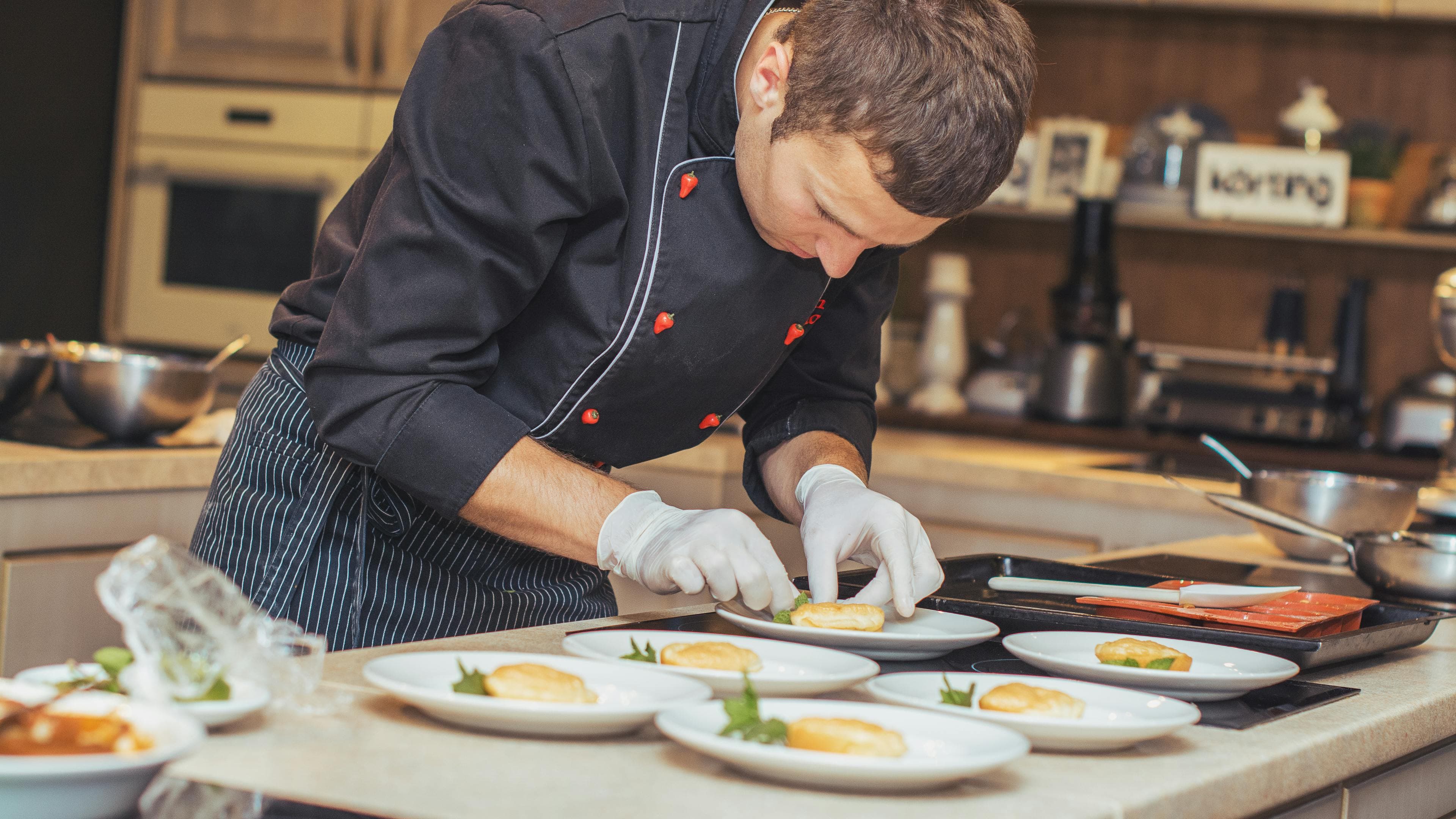 Chef Paul Graham plating at the pass