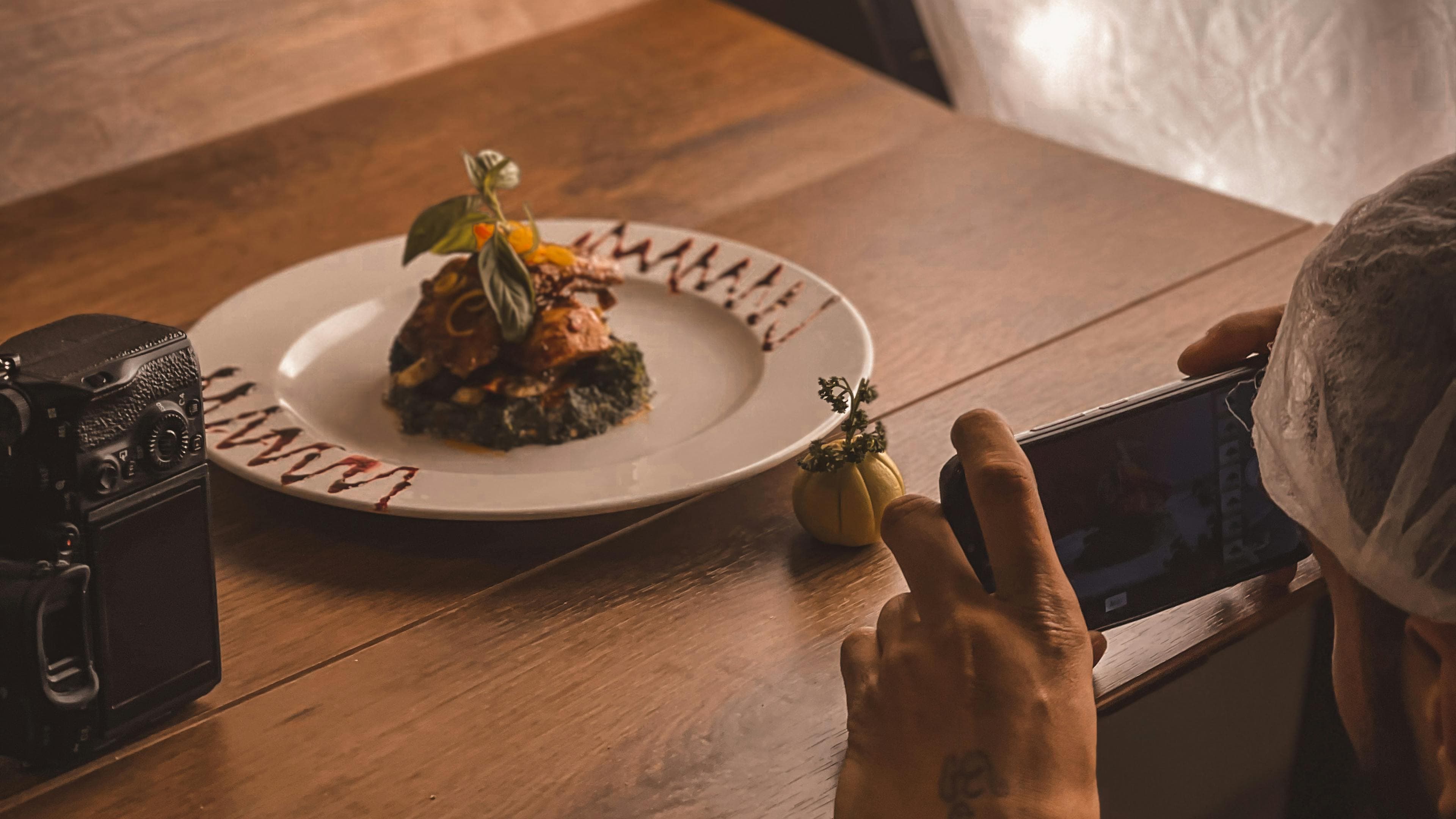 Plated tasting course with precise sauce work and negative space
